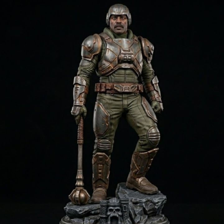 Man-At-Arms es uno de los personajes más importantes de Masters of the Universe. Su nombre real es Duncan y ocupa el título de “Maestro de Armas”, siendo el ingeniero, inventor y estratega militar principal del reino de Eternia, además de mentor de He-Man y padre adoptivo de Teela.